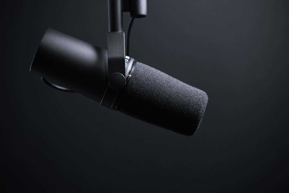 black and silver microphone with white background